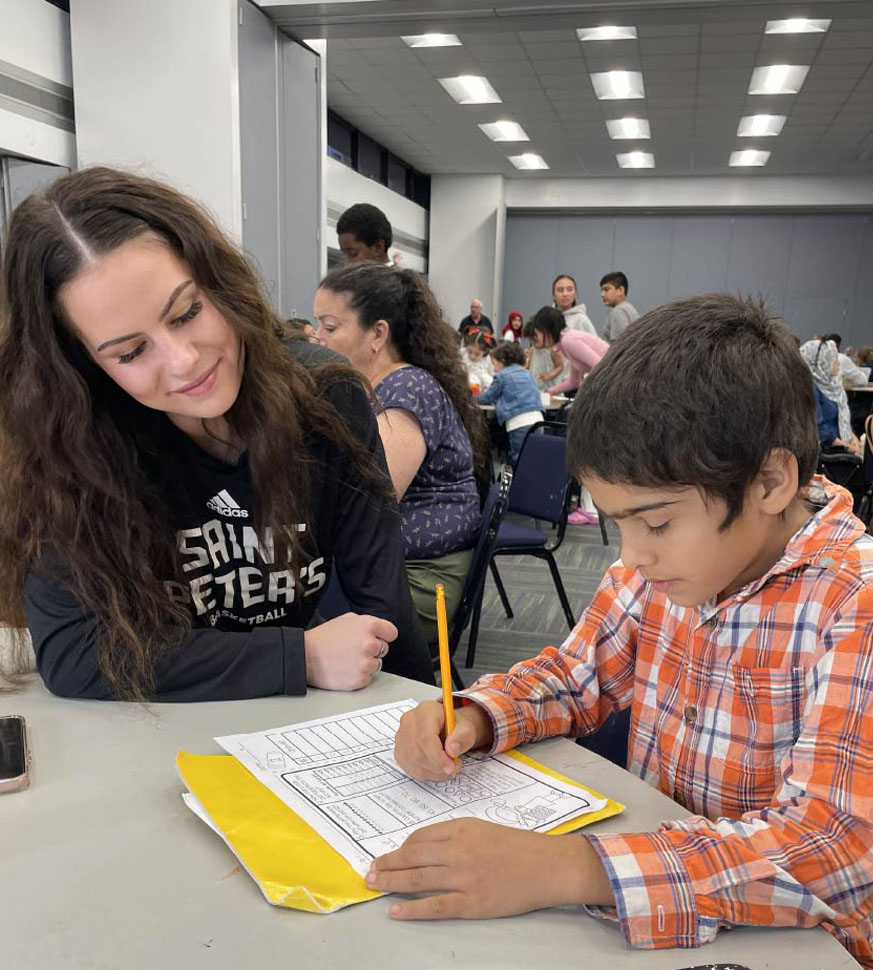 Woman tutor and studious child