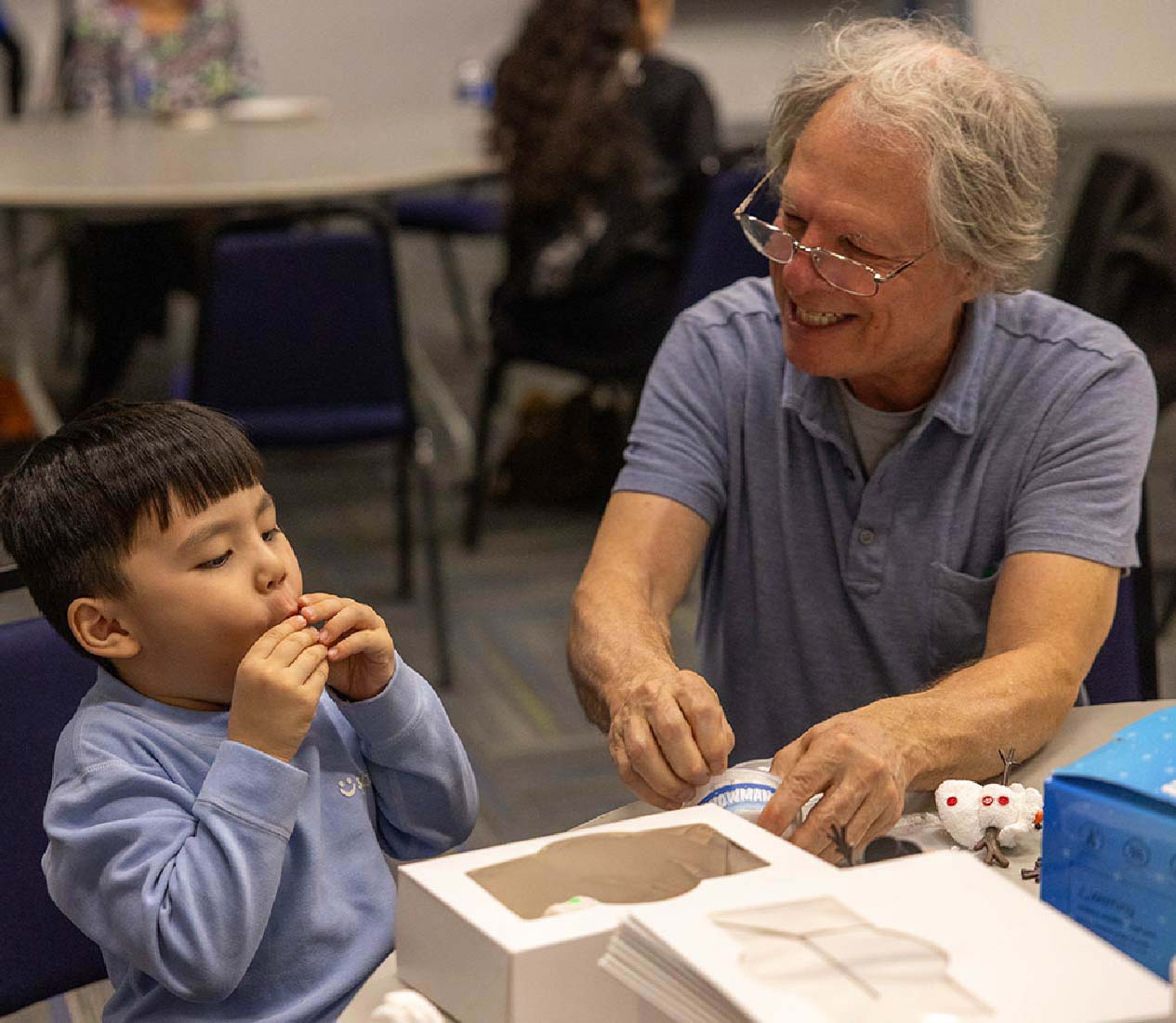 Crafts activities, smiling man and child