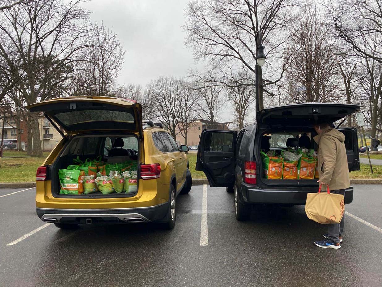 Volunteers loading up vehicles to make deliveries